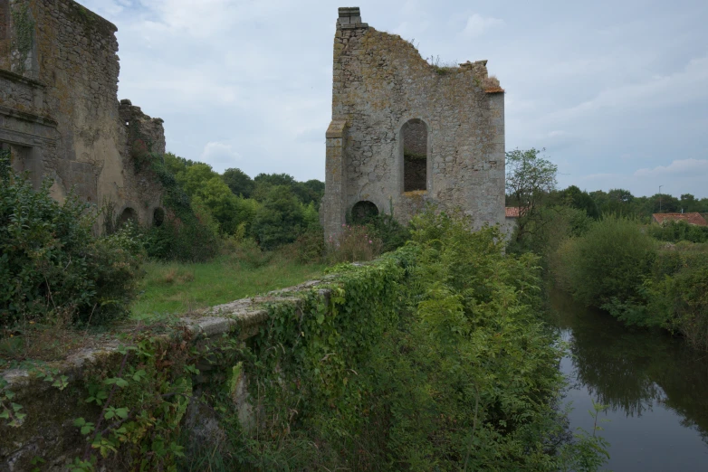 an old stone castle sitting on top of a hill