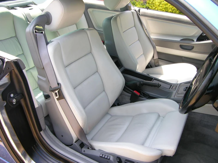 the interior of a car with leather seats