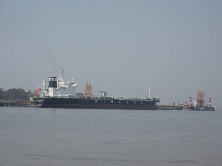 a large boat is anchored in the water