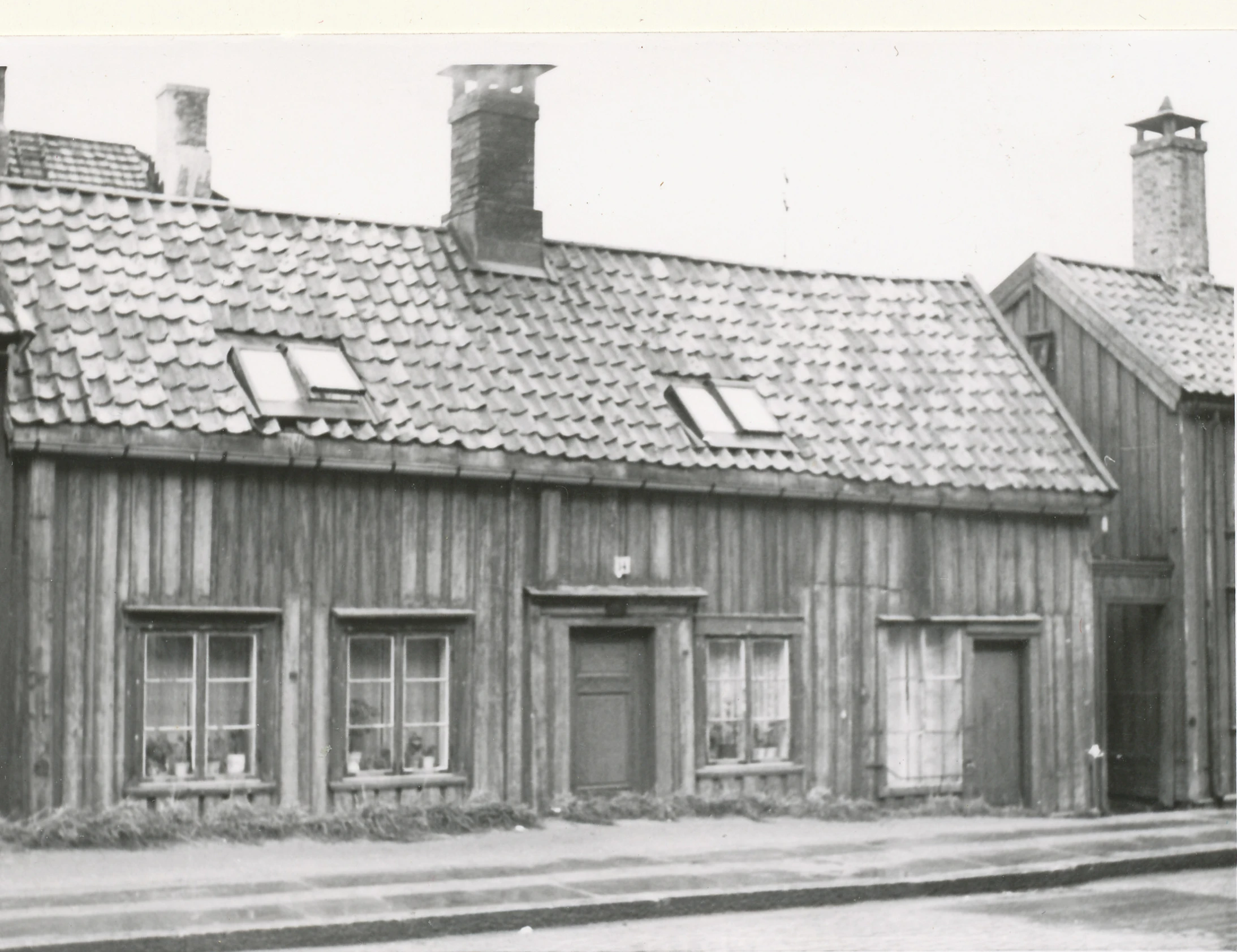 an old house sitting outside in the town