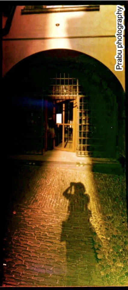 shadow of someone in front of an archway