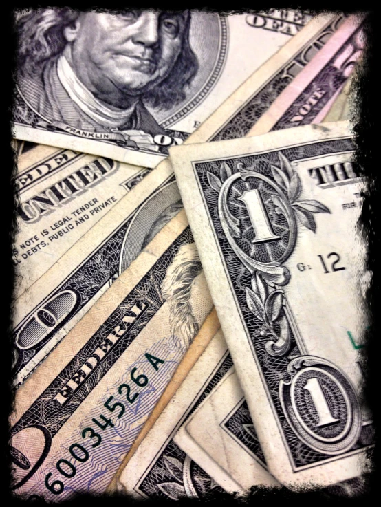 four hundred dollar bill stacked on top of each other