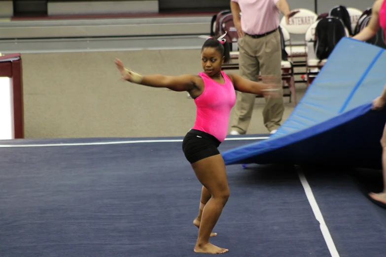 a woman standing on the edge of a trampoline