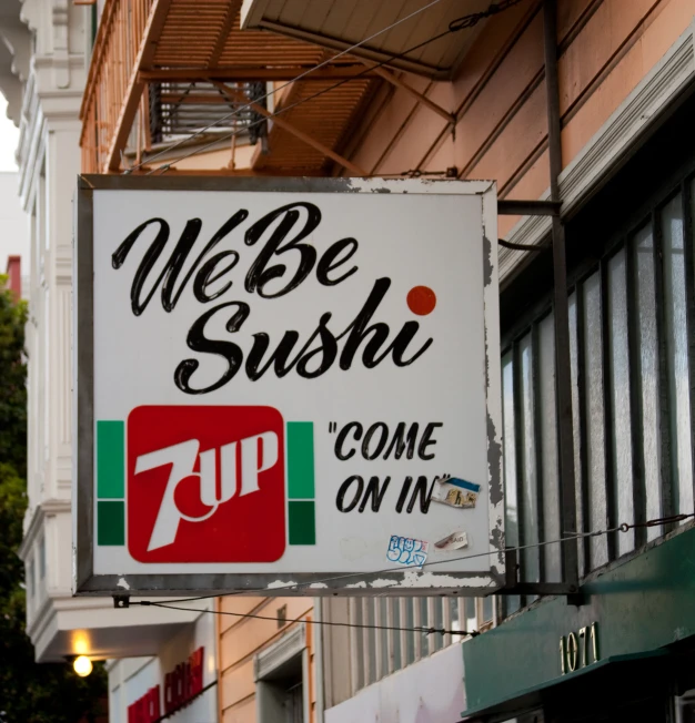 a white sign advertising sushi with a 7up logo