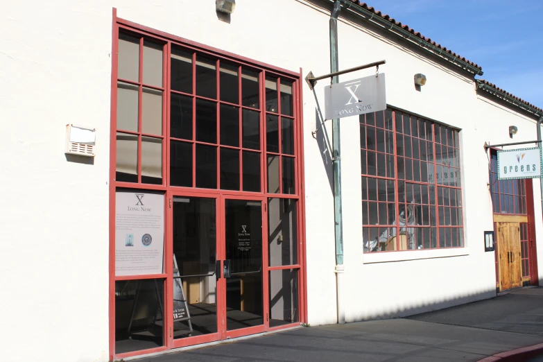 the entrance of a store front with a glass door