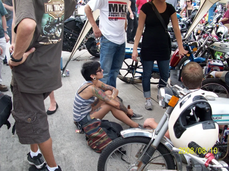 a group of people standing around and sitting around