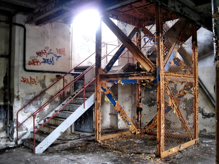 a very old building with some stairs and a light at the top