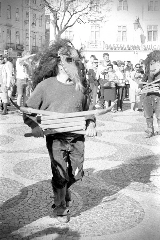 a black and white po of an older man with a beard carrying a kite