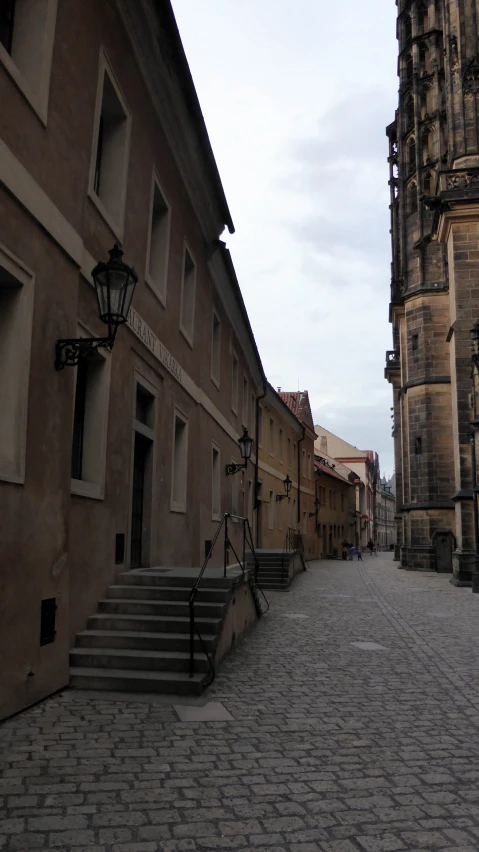 street with buildings in the distance and a clock tower