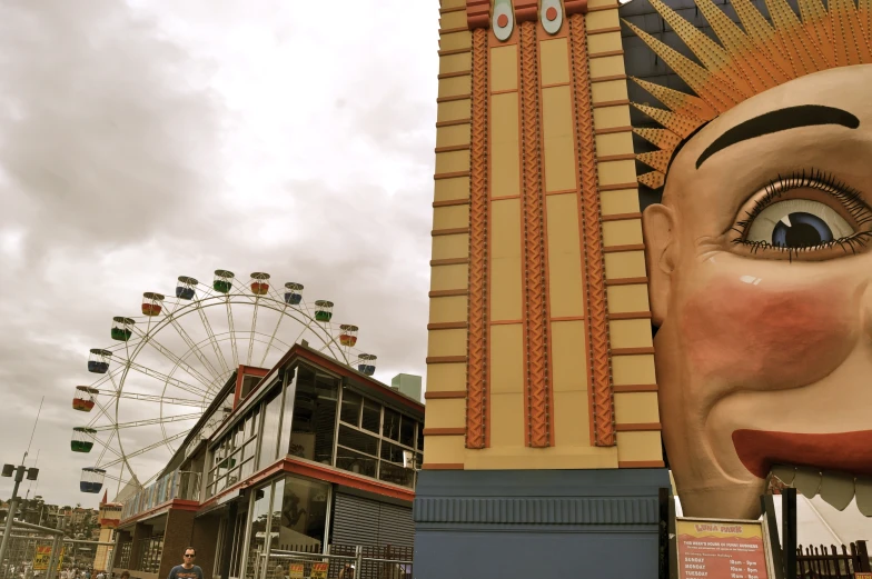 a giant statue sitting in front of a tall building