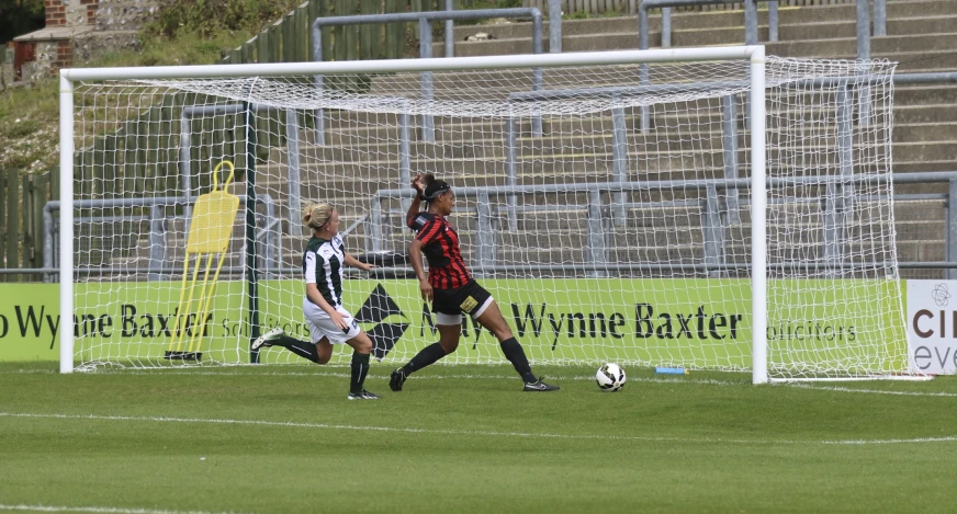 the soccer players are playing soccer on the field