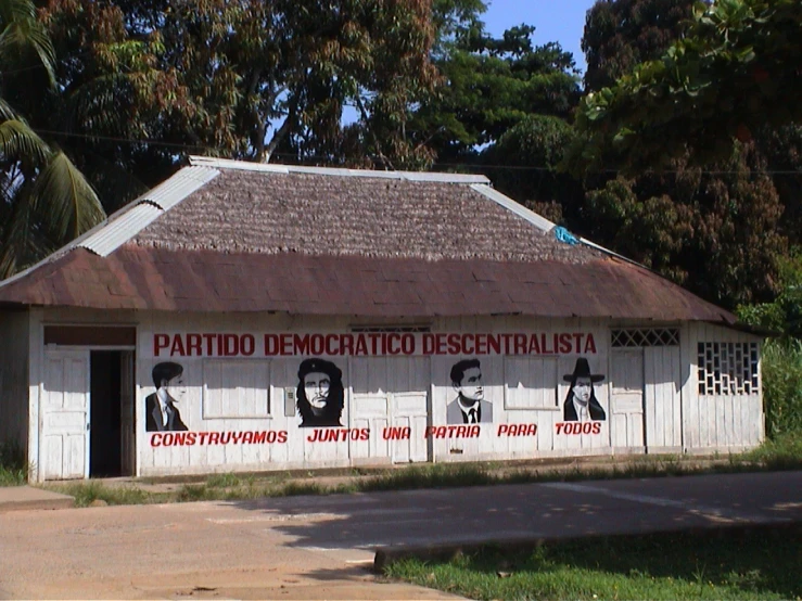 this old, run down building has been decorated with propaganda