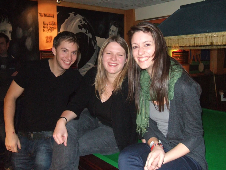 two men and two women are posing for a picture