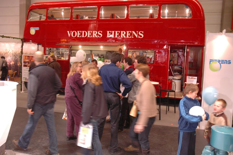 people are looking inside a london shop and talking