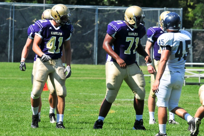 the football team is warming up before their game