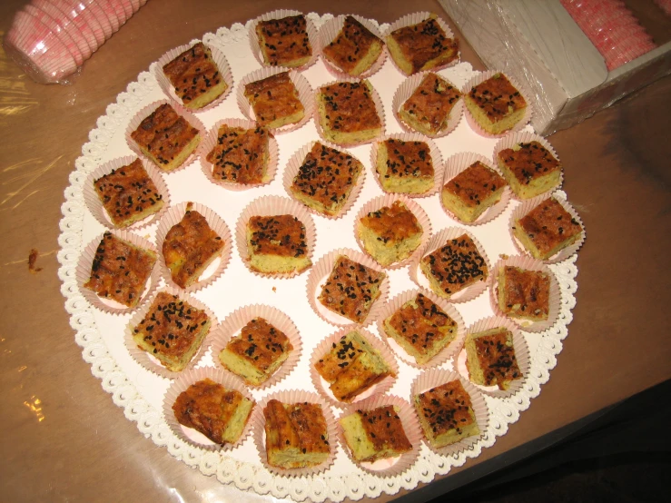 a plate with cupcakes on it, ready to be eaten