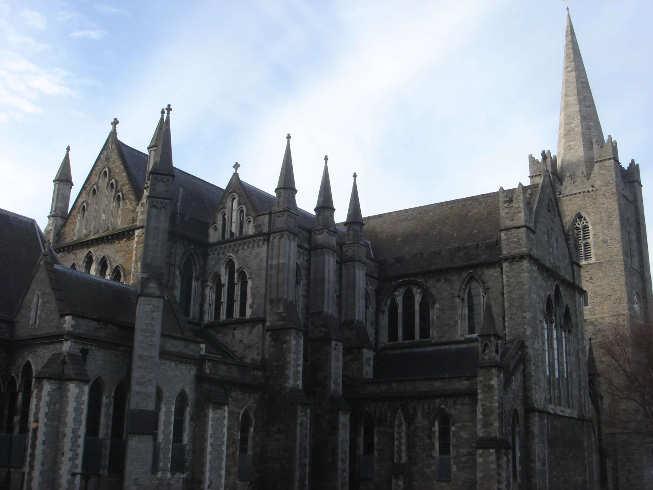 this old gothic - style cathedral looks over an almost - ruined street