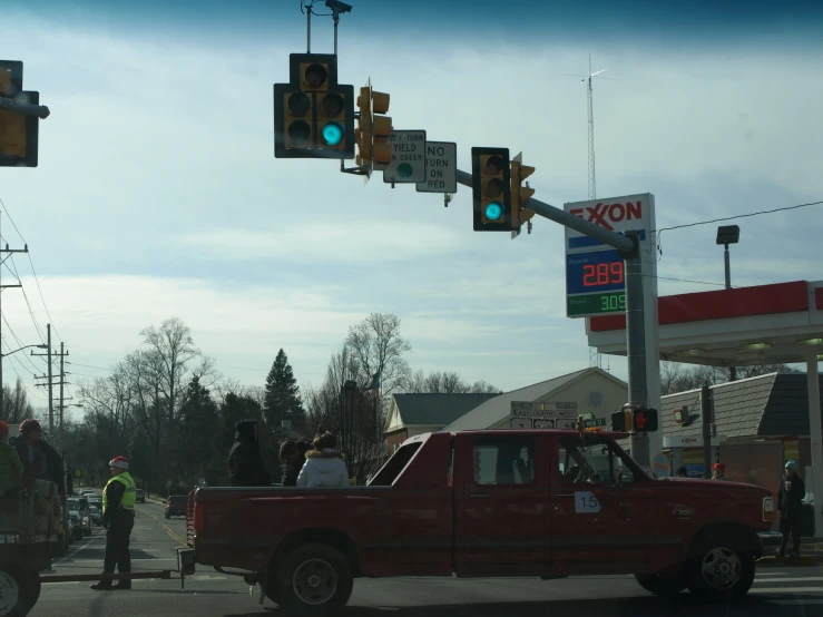 a person in the back of a red truck