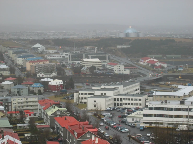 city from up in the air with cars and buildings around