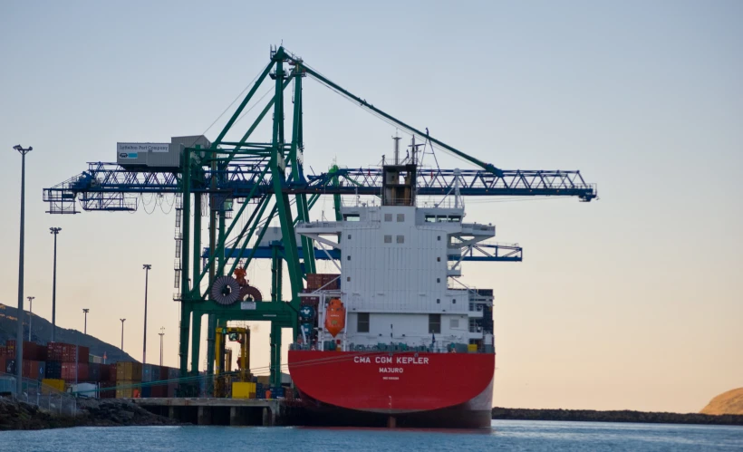 a large red and white boat in the water