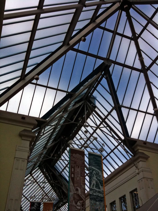 view from underneath of a long glass - roofed roof