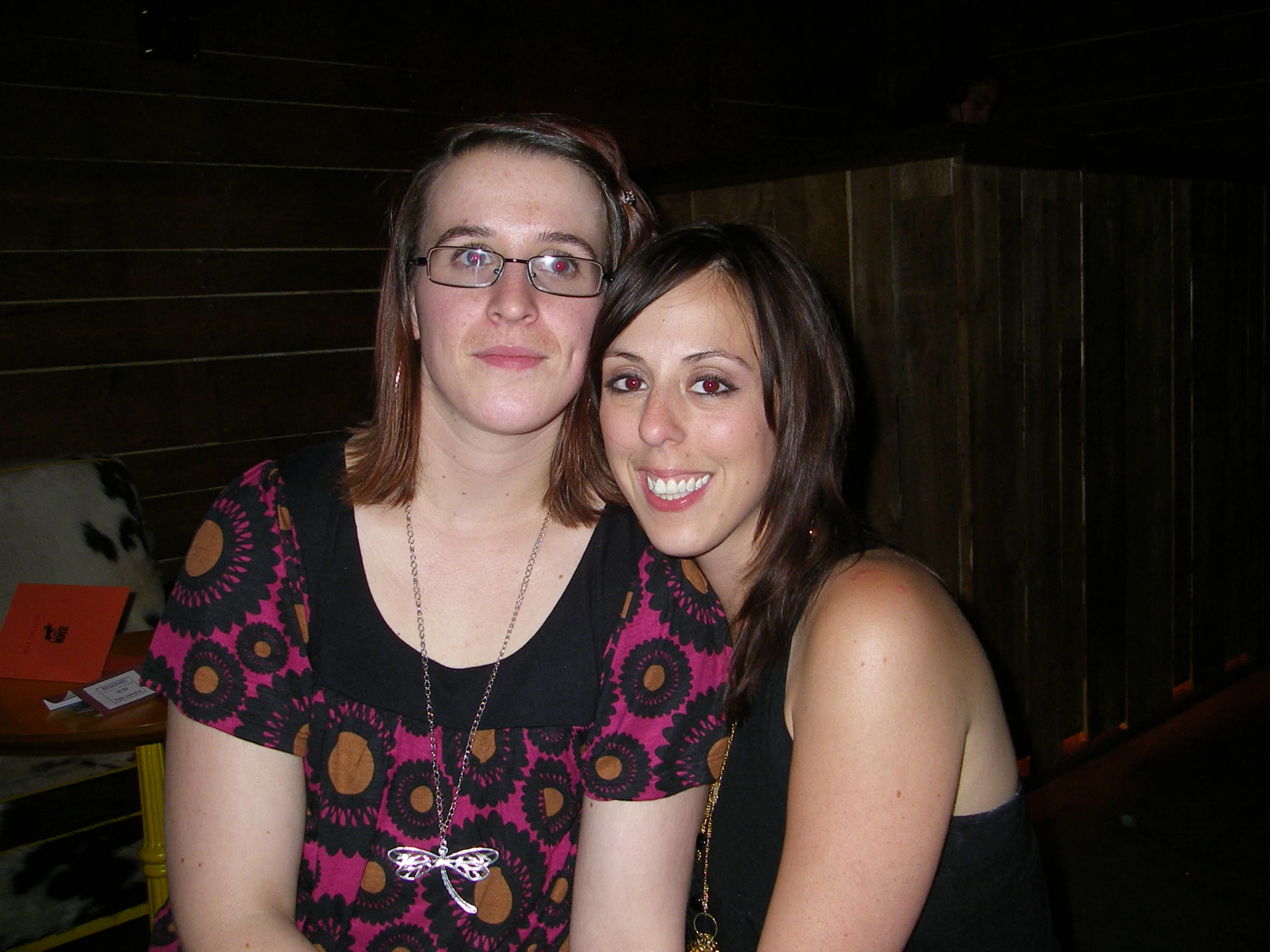 two women are posing for the camera together