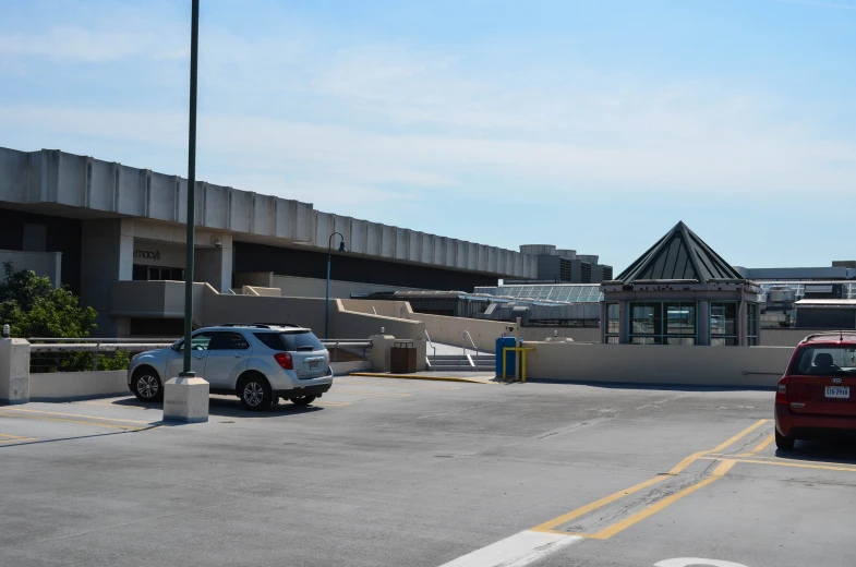 two vehicles parked in a empty parking lot