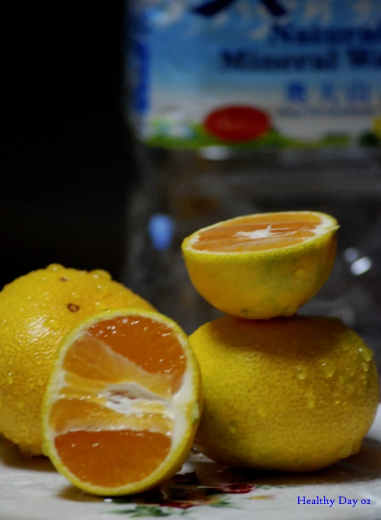 several slices of lemon sitting on a flowered plate