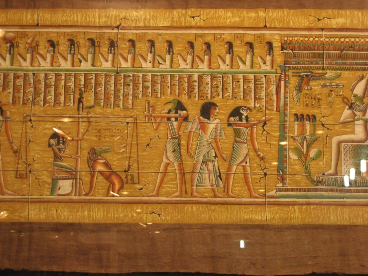 ancient egyptian wall paintings on wooden paneling