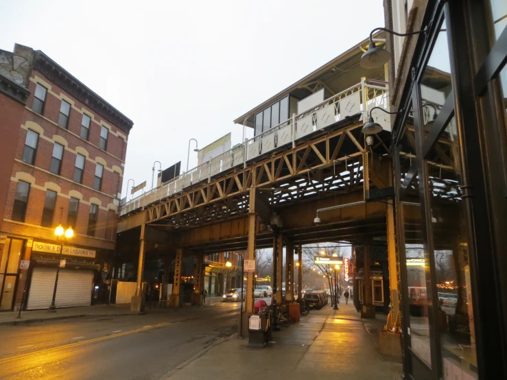 some tall buildings and a large train bridge