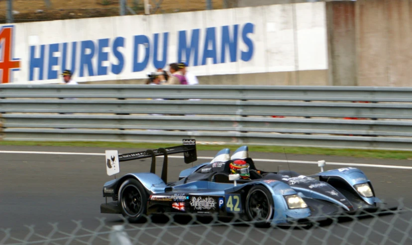 a race car in motion on the track