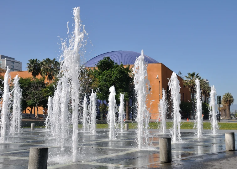 the water fountain in the middle of a park