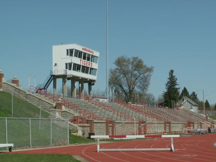 a large stadium filled with lots of red seats