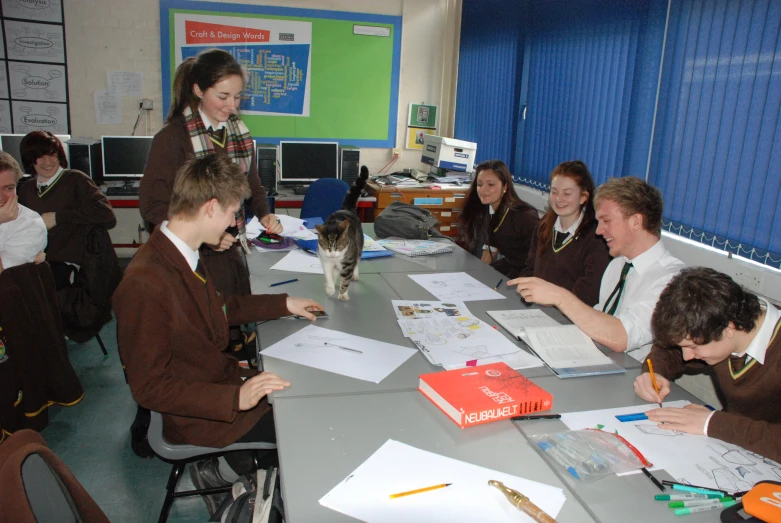 a school desk full of students sitting at it