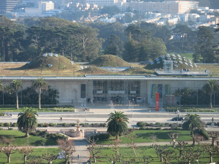 a green roof on top of an old building in the park