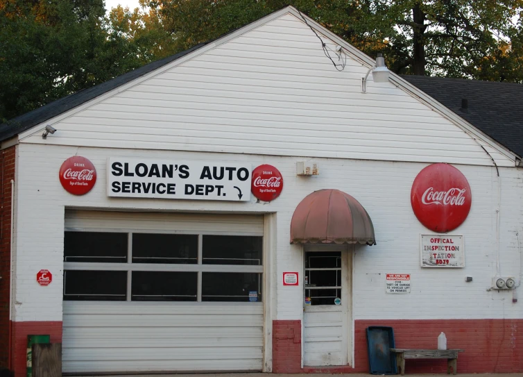 a white and red building with an automatic service depot