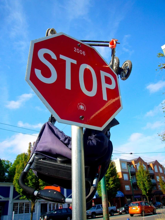 a red stop sign sitting on top of a metal pole