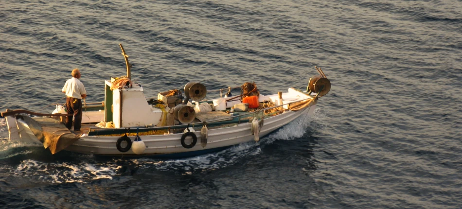 a boat on a body of water with people in it