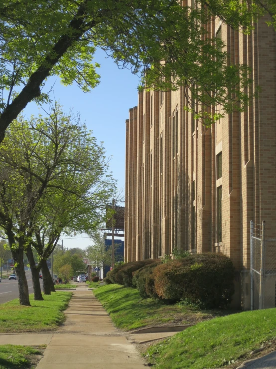 the building has many trees along the side