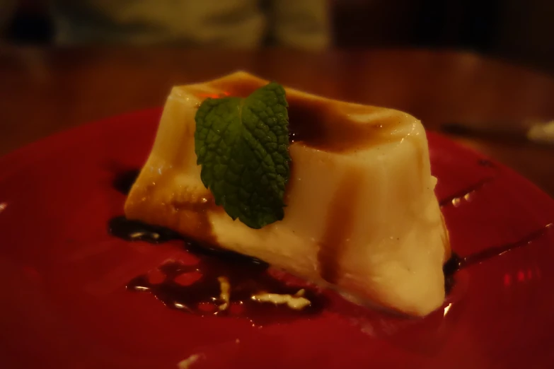 a dessert has a green leaf placed on it