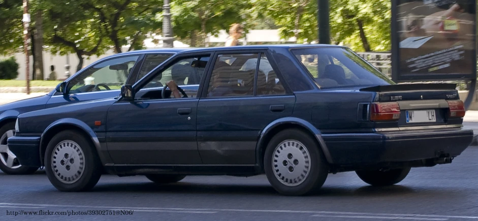 a car driving down a road in the city