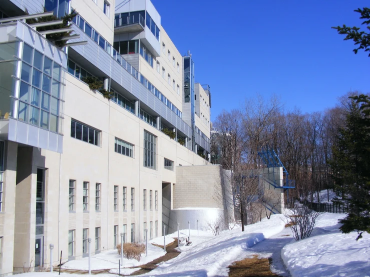 a large building on top of a snowy hill