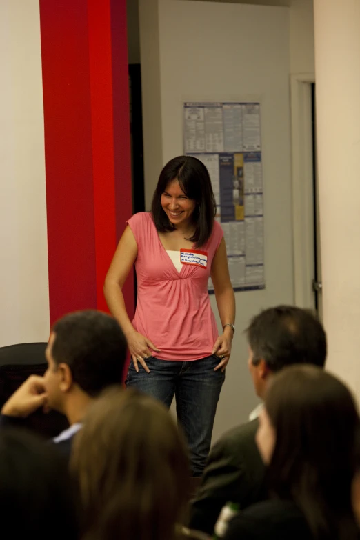 a woman giving a presentation at an event