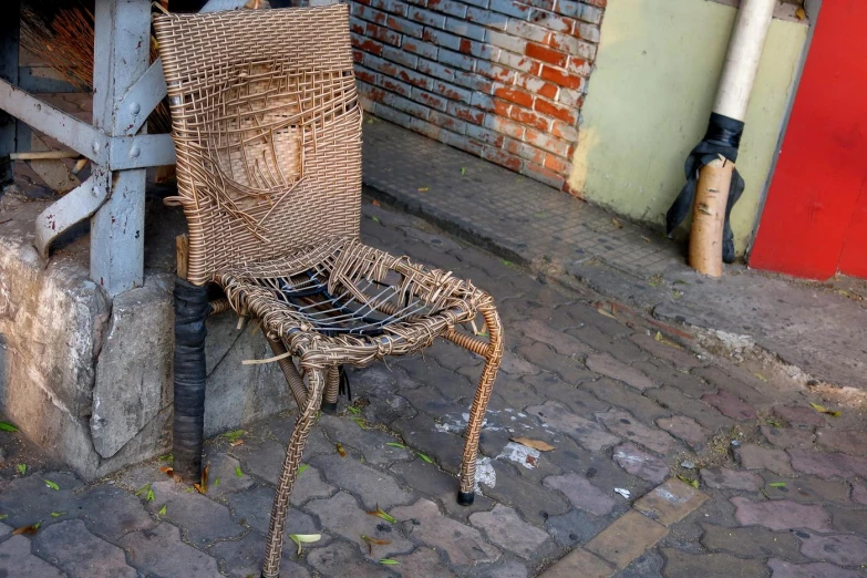 a chair made from rope and some kind of chair sitting next to it