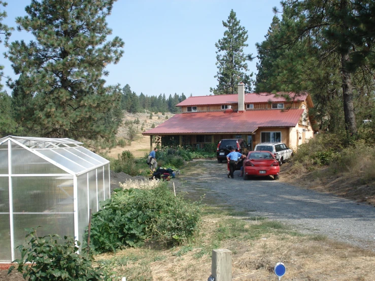 a group of people in front of a house