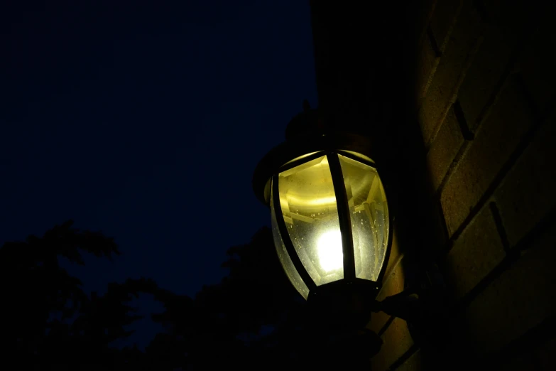 a lamppost with a street light at night