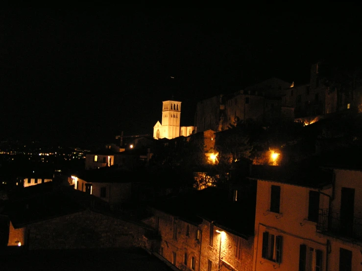 view of a city lit up at night from rooftop