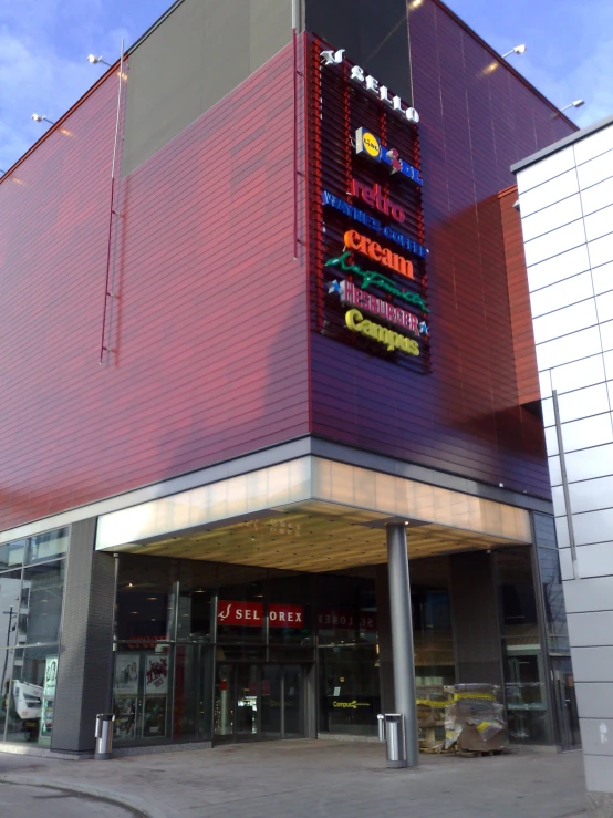 the front of a building with signs on it