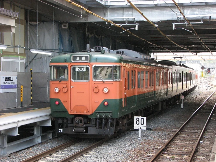 a train is at a depot waiting for passengers