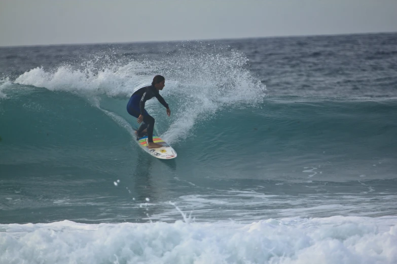 a man is surfing on a wave in the ocean